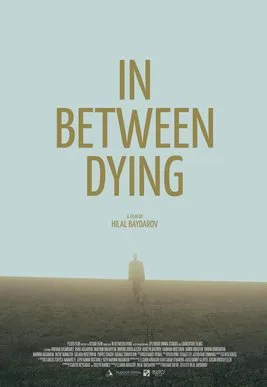 In Between Dying poster