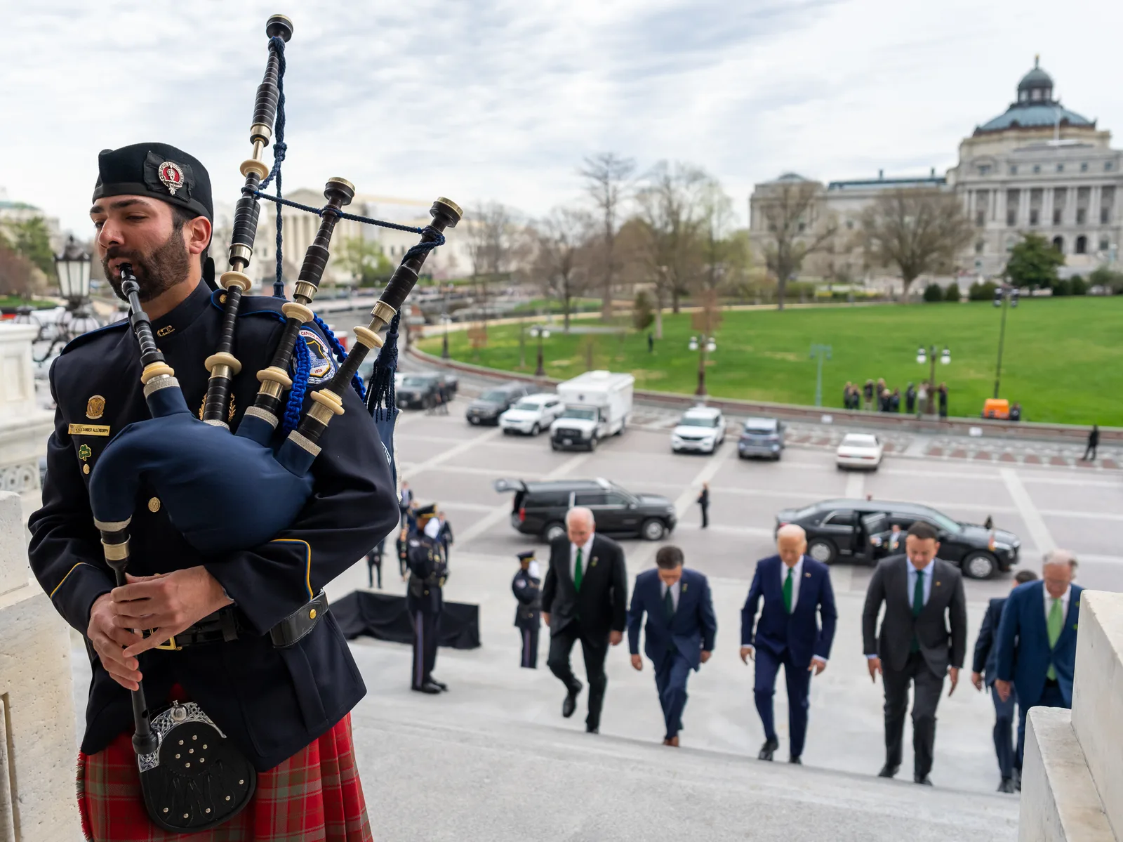 A U.S. Capitol Police bagpiper performs as President Joe Biden walks into the U.S. Capitol with Rep. Mike Kelly (R-PA), from left, House Speaker Mike Johnson (R-LA), Taoiseach of Ireland Leo Varadkar and Rep. Richard Neal (D-MA), Friday, March 15, 2024, prior to the annual Friends of Ireland Lunche…