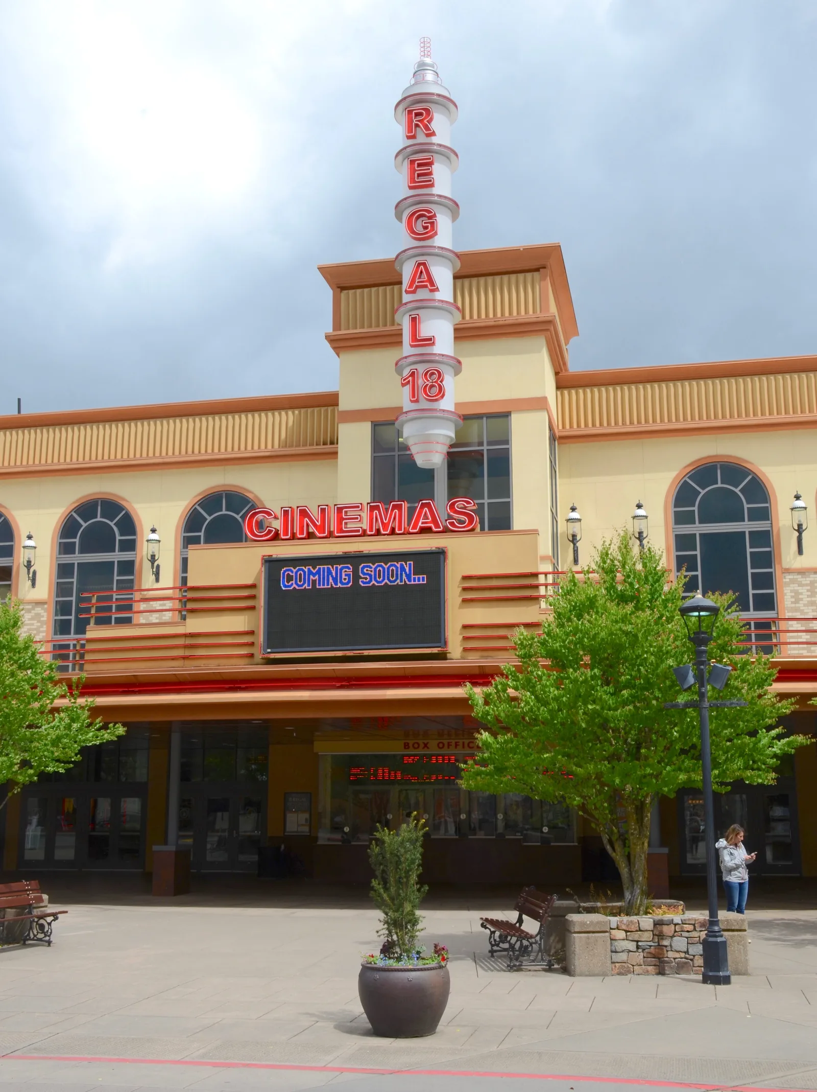 A Regal Cinemas marquee and entrance illuminated at dusk