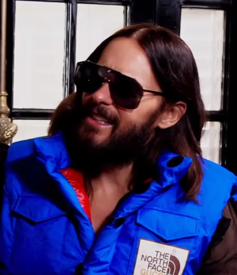 Jared Leto during an interview in 2022, wearing a blue jacket and sunglasses
