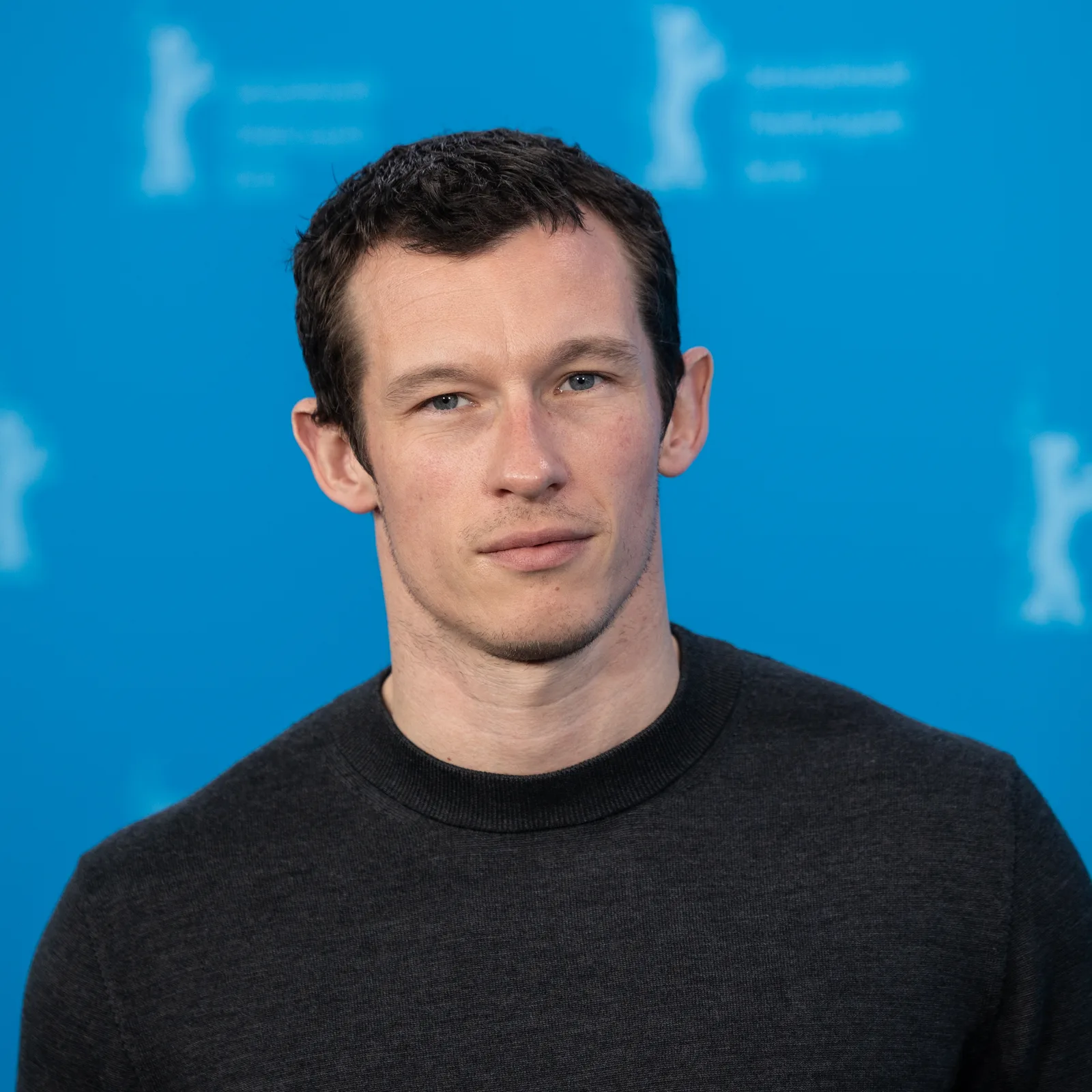 Callum Turner wearing a dark suit at the 2024 Venice International Film Festival