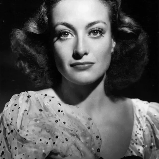 Joan Crawford photographed by George Hurrell in 1936, eight years after Our Dancing Daughters made her a star.