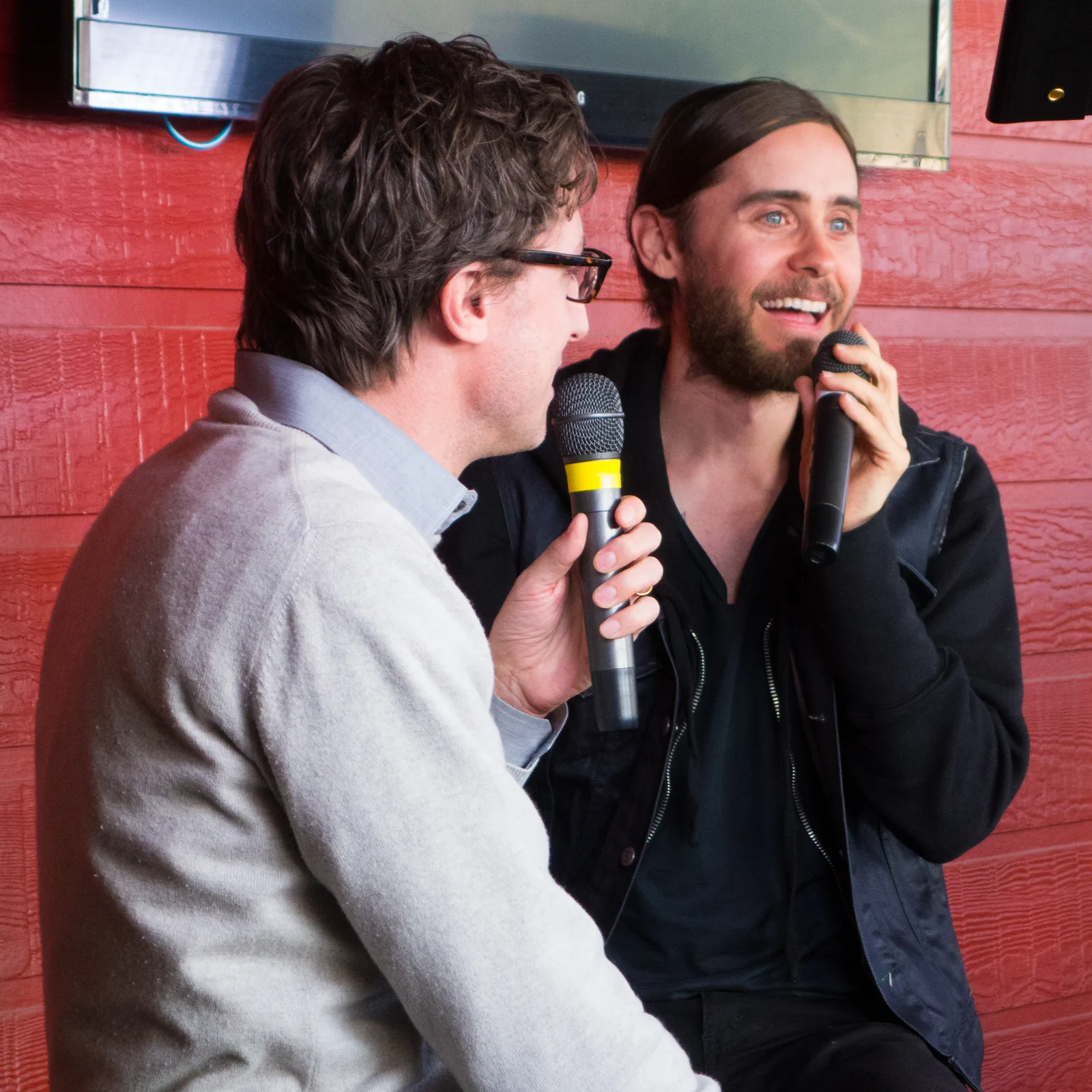 Jared Leto holding a microphone during a South by Southwest appearance in 2013