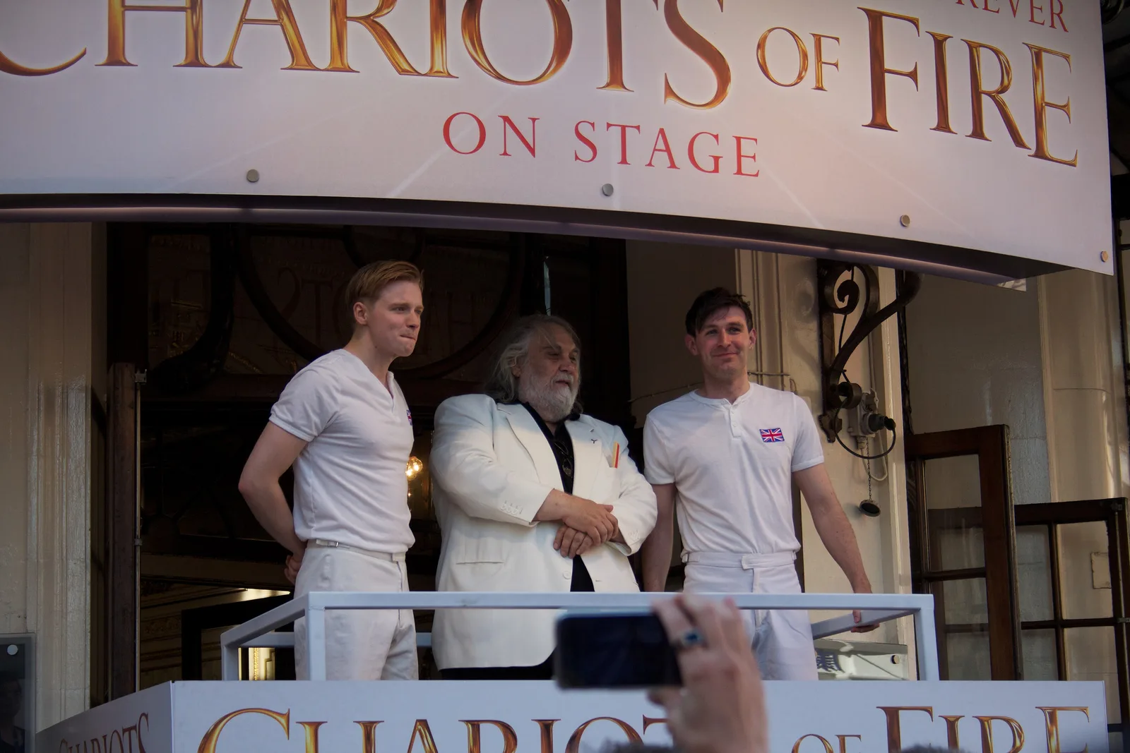 Left to right: Actor Jack Lowden, composer Vangelis, actor James McArdle of the play Chariots of Fire at the London 2012 Olympics torch relay.