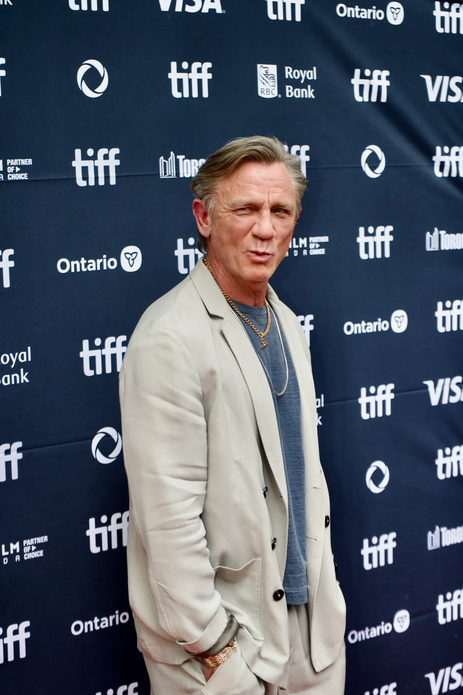 Daniel Craig posing on the Toronto International Film Festival red carpet in 2025